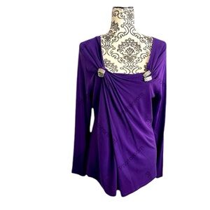 Stunning vibrant purple top with clasps along collarbone